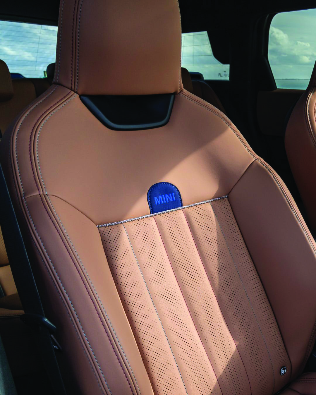 Premium tan leather vehicle seat with tailored stitching